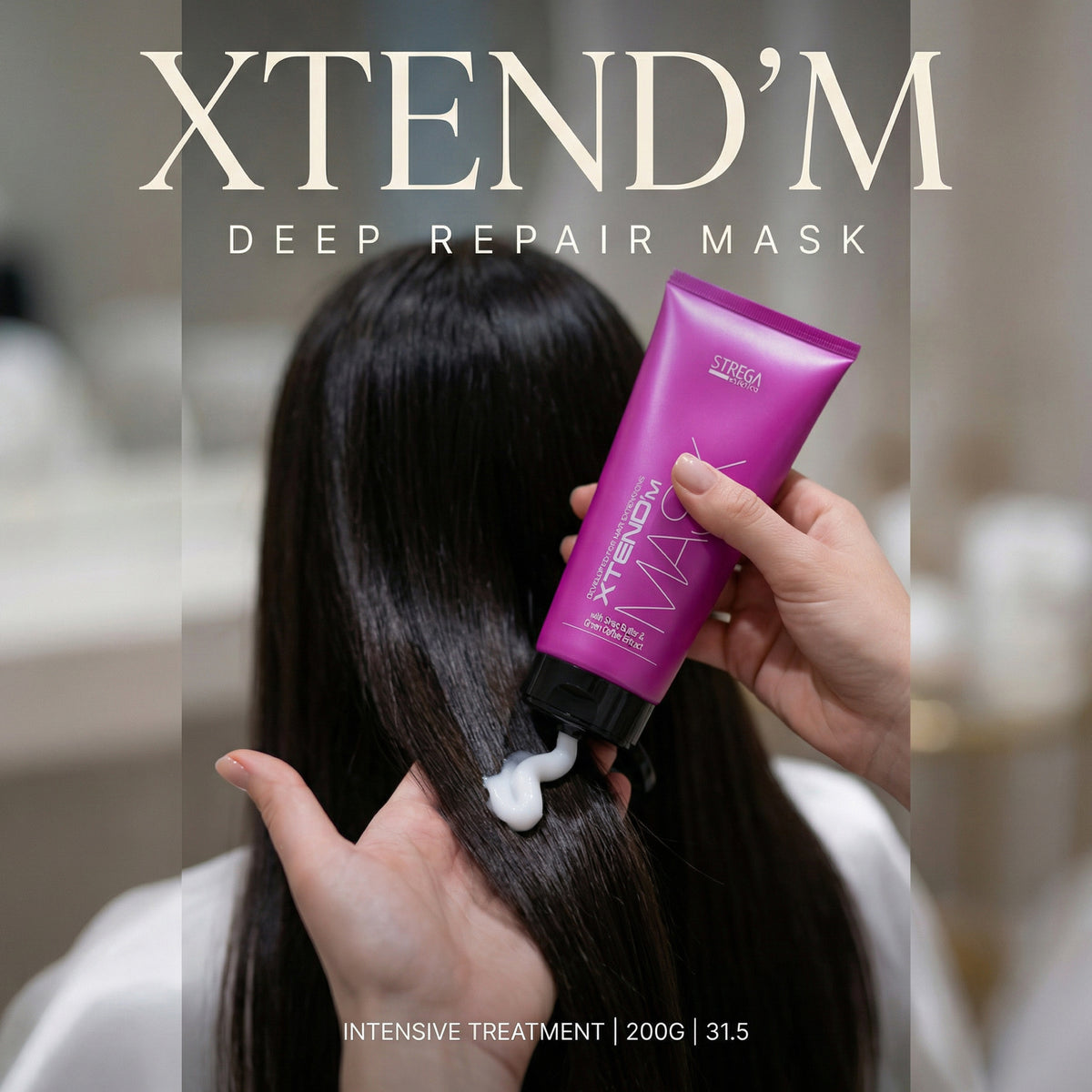 A person with long dark hair receives a deep repair mask treatment. A hand holds a bright pink tube labeled XTEND'M MASK against the hair, with white mask cream being squeezed onto the strands.